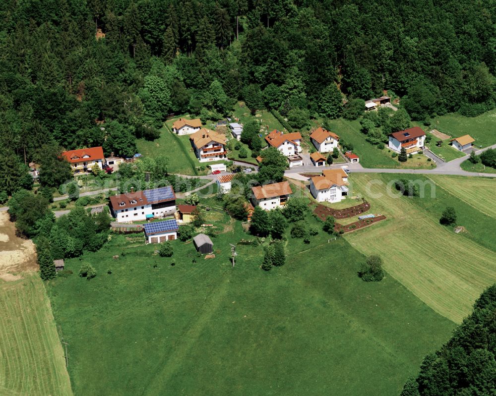 Atzesberg from the bird's eye view: Agricultural land and field boundaries surround the settlement area of the village in Atzesberg in the state Bavaria, Germany