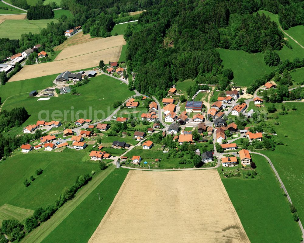 Auerbach from above - Agricultural land and field boundaries surround the settlement area of the village in Auerbach in the state Bavaria, Germany
