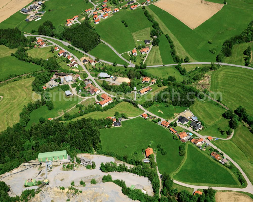 Auerbach from the bird's eye view: Agricultural land and field boundaries surround the settlement area of the village in Auerbach in the state Bavaria, Germany