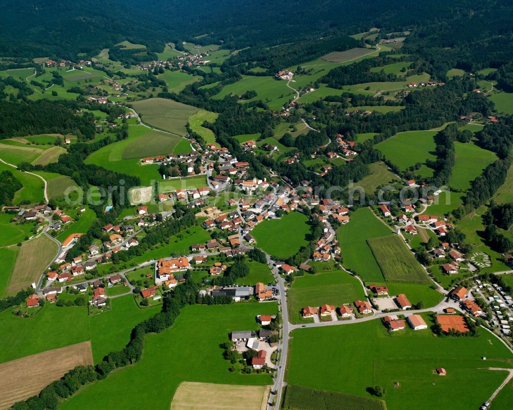 Außerirlach from above - Agricultural land and field boundaries surround the settlement area of the village in Außerirlach in the state Bavaria, Germany