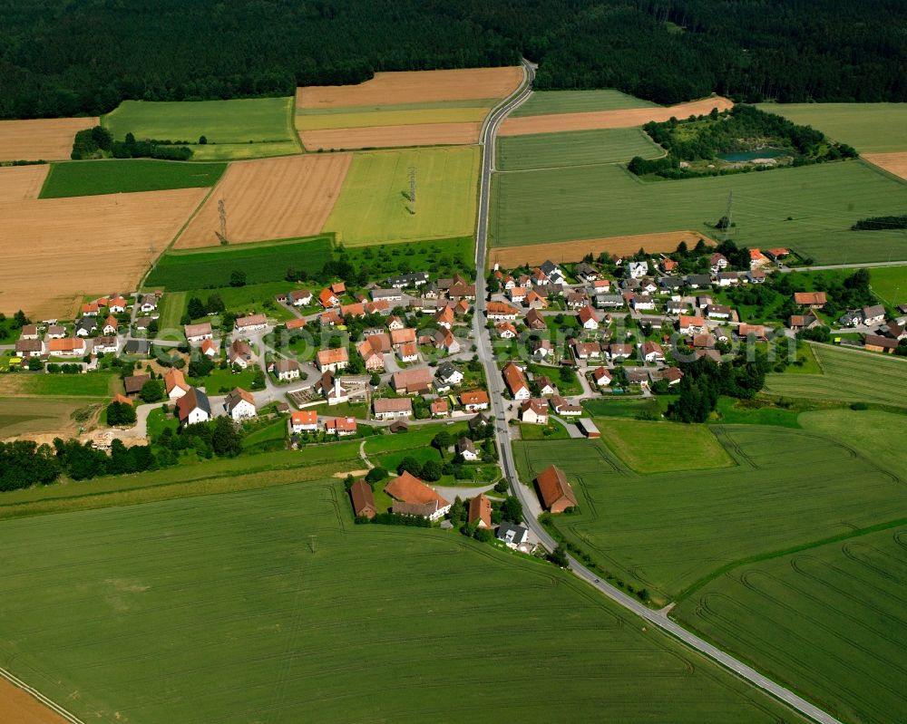 Bad Saulgau from above - Agricultural land and field boundaries surround the settlement area of the village in Bad Saulgau in the state Baden-Wuerttemberg, Germany