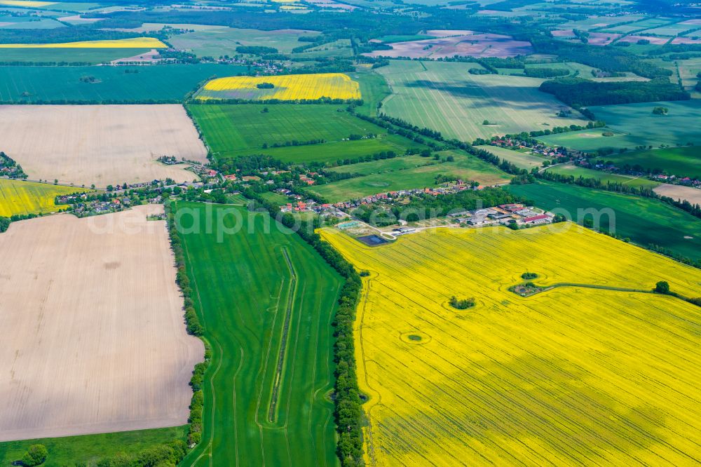 Aerial image Balow - Agricultural land and field boundaries surround the settlement area of the village in Balow in the state Mecklenburg - Western Pomerania, Germany