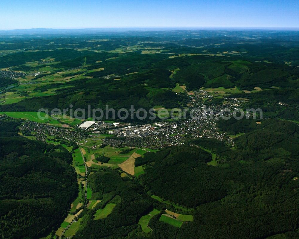 Banfe from the bird's eye view: Agricultural land and field boundaries surround the settlement area of the village in Banfe at Siegerland in the state North Rhine-Westphalia, Germany