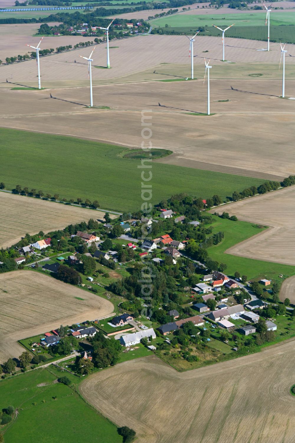 Barkow from above - Agricultural land and field boundaries surround the settlement area of the village in Barkow in the state Mecklenburg - Western Pomerania, Germany