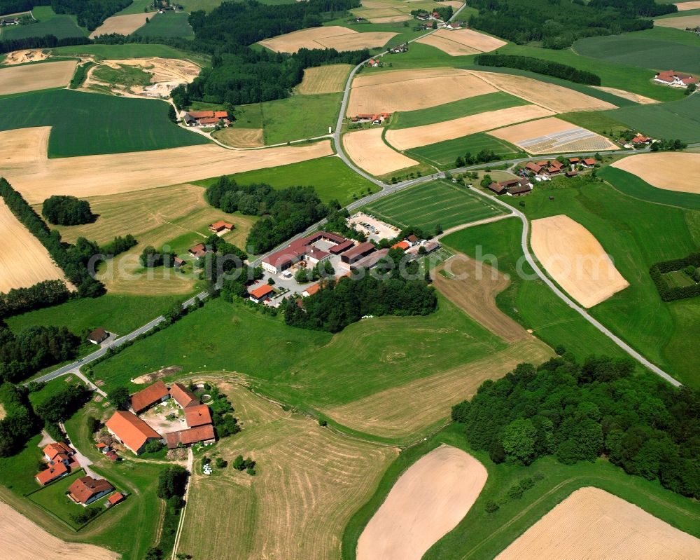 Benk from above - Agricultural land and field boundaries surround the settlement area of the village in Benk in the state Bavaria, Germany
