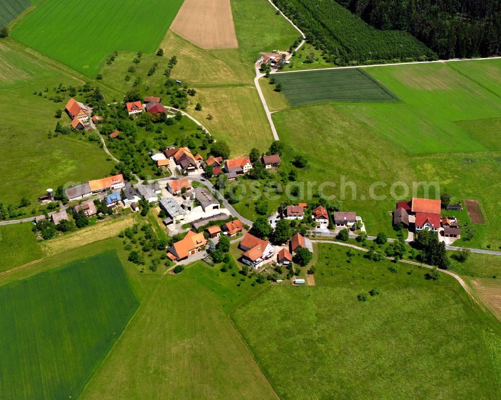 Überberg from the bird's eye view: Agricultural land and field boundaries surround the settlement area of the village in Überberg in the state Baden-Wuerttemberg, Germany