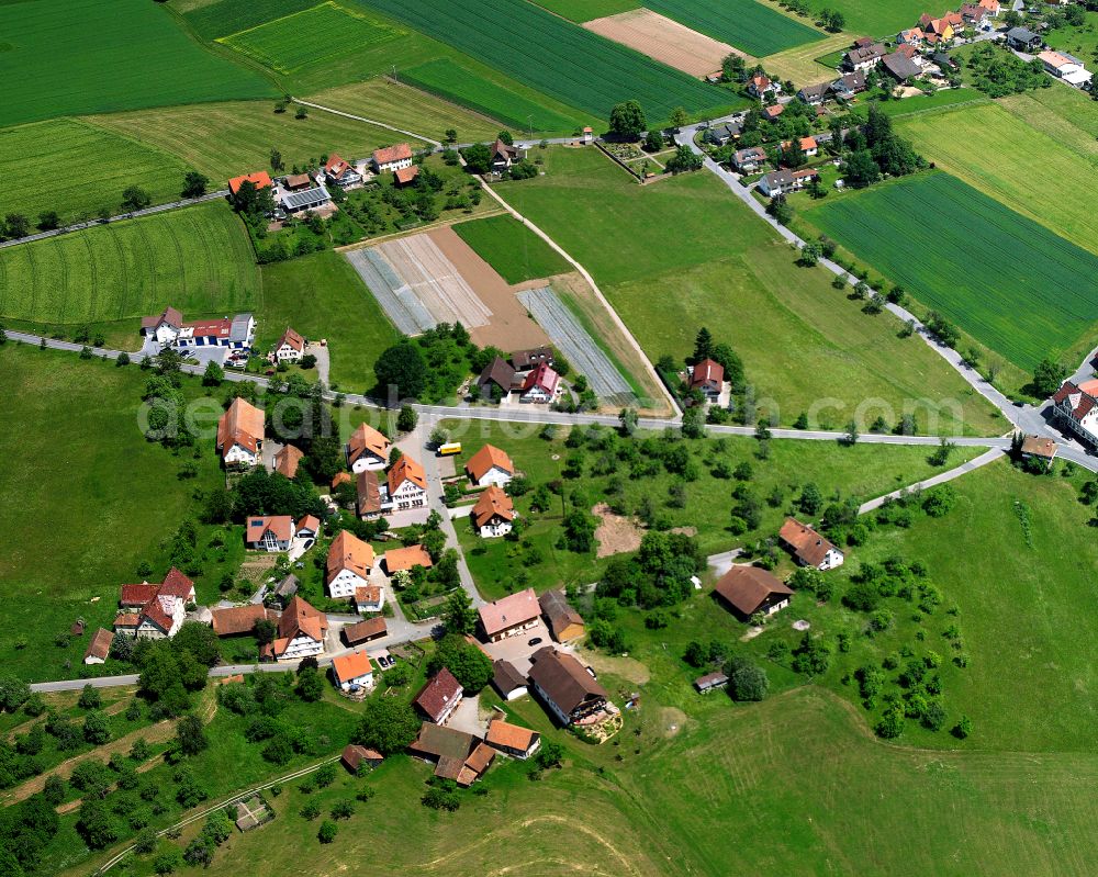 Aerial image Überberg - Agricultural land and field boundaries surround the settlement area of the village in Überberg in the state Baden-Wuerttemberg, Germany