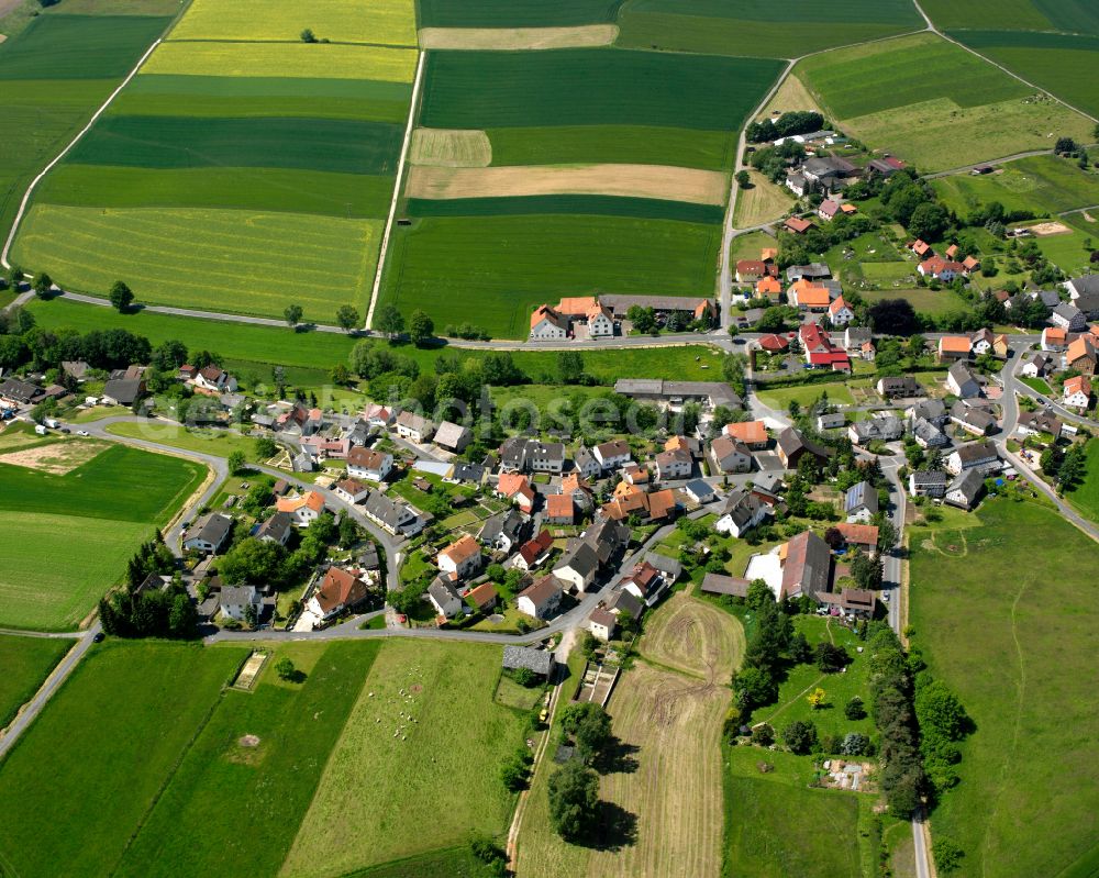 Berfa from the bird's eye view: Agricultural land and field boundaries surround the settlement area of the village in Berfa in the state Hesse, Germany