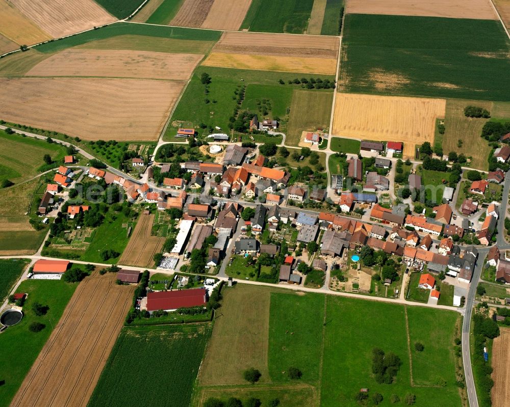 Bittelbronn from the bird's eye view: Agricultural land and field boundaries surround the settlement area of the village in Bittelbronn in the state Baden-Wuerttemberg, Germany