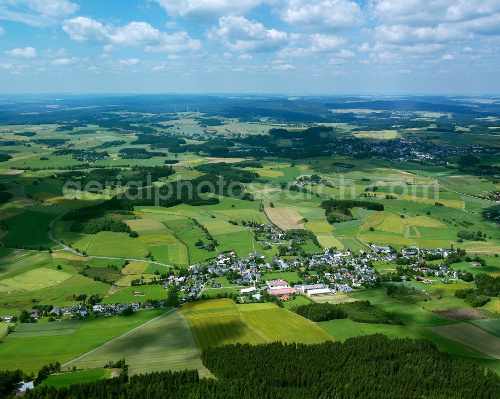 Bobengrün from above - Agricultural land and field boundaries surround the settlement area of the village in Bobengrün in the state Bavaria, Germany
