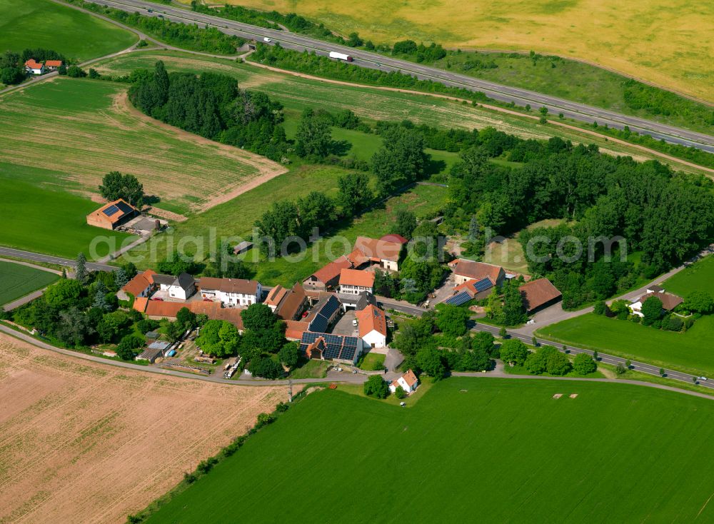 Aerial photograph Bolanden - Agricultural land and field boundaries surround the settlement area of the village in Bolanden in the state Rhineland-Palatinate, Germany
