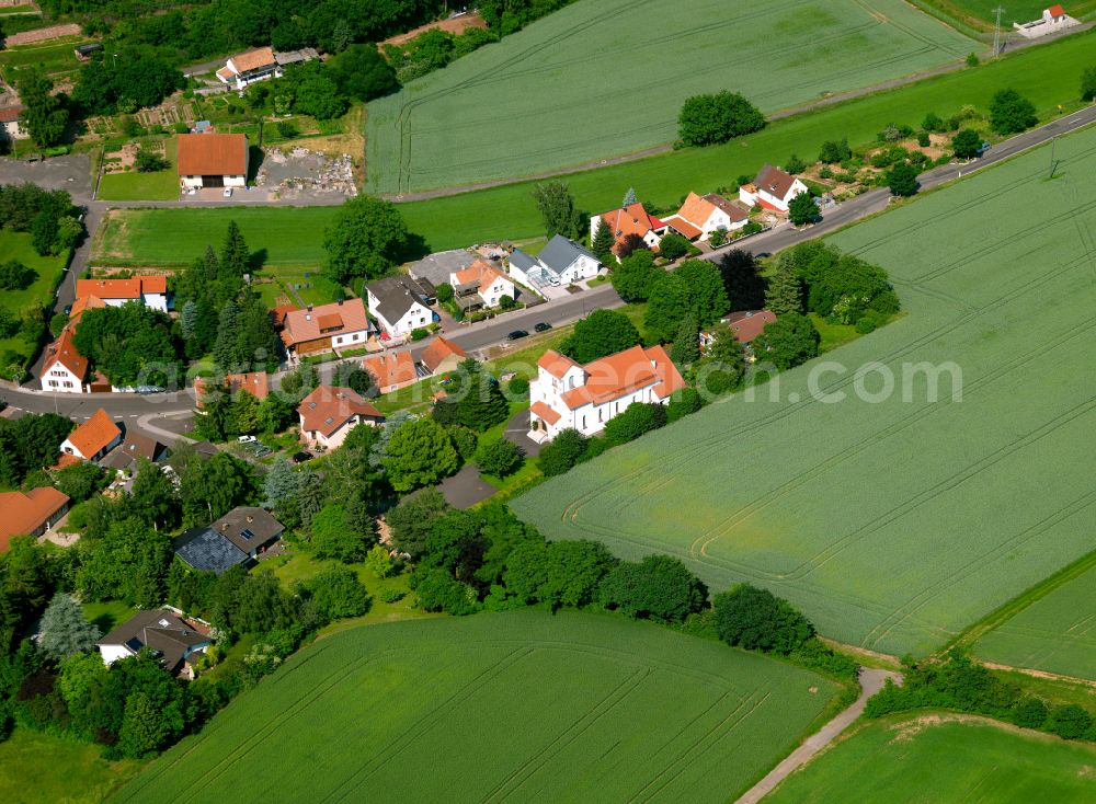 Bolanden from the bird's eye view: Agricultural land and field boundaries surround the settlement area of the village in Bolanden in the state Rhineland-Palatinate, Germany
