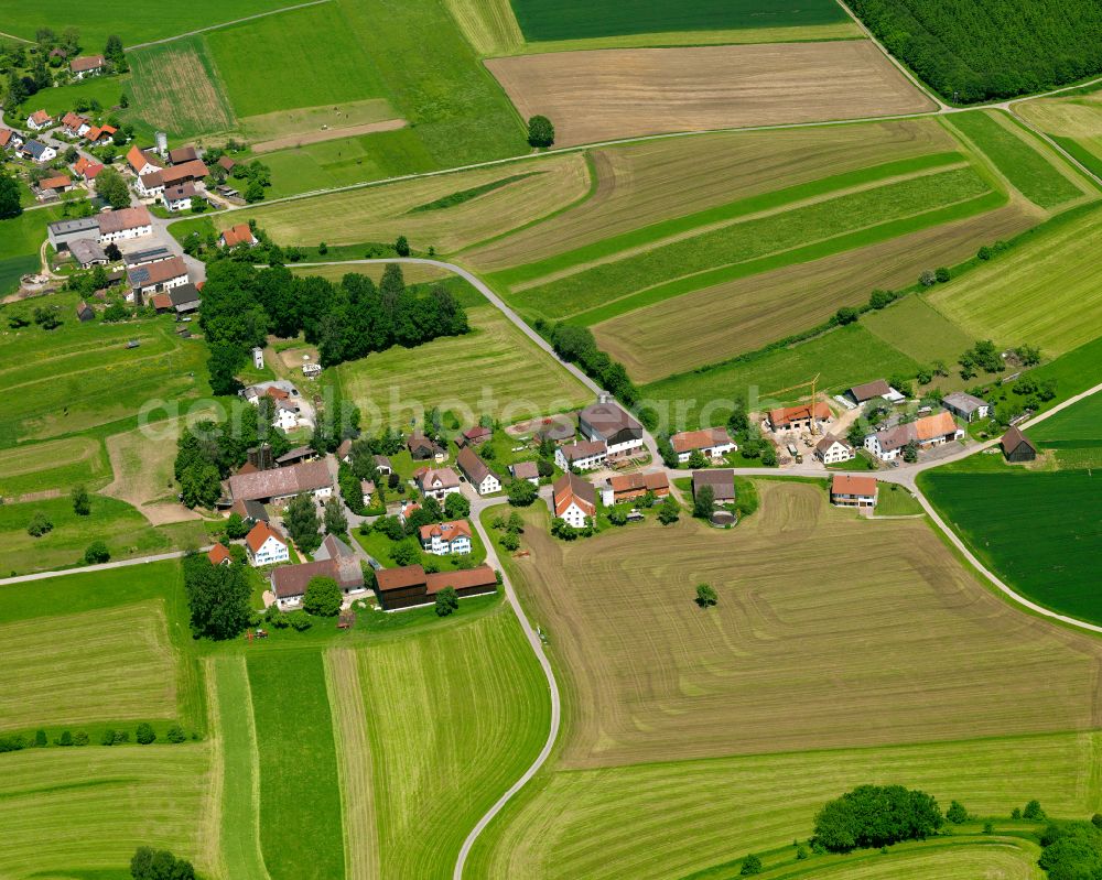 Bollsberg from above - Agricultural land and field boundaries surround the settlement area of the village in Bollsberg in the state Baden-Wuerttemberg, Germany