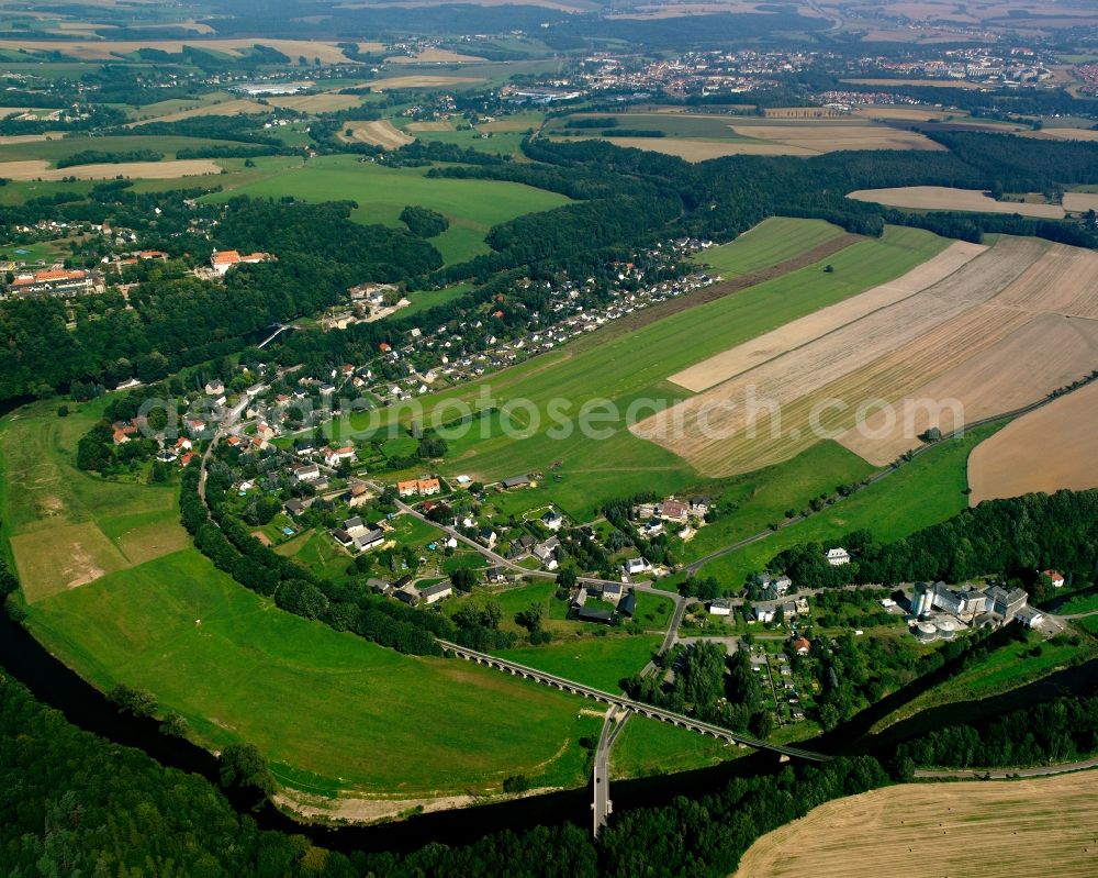 Braunsdorf from above - Agricultural land and field boundaries surround the settlement area of the village in Braunsdorf in the state Saxony, Germany