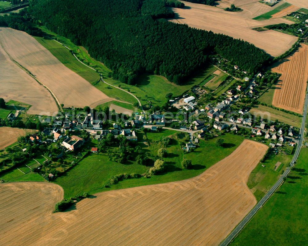 Aerial image Brückla - Agricultural land and field boundaries surround the settlement area of the village in Brückla in the state Thuringia, Germany