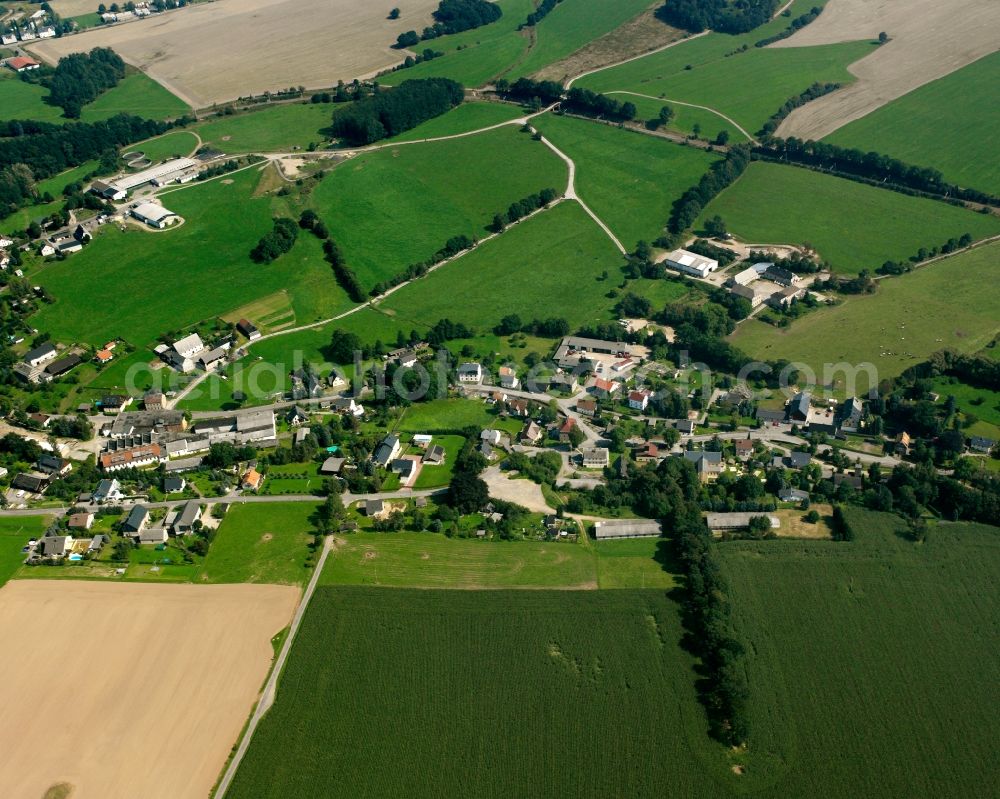 Breitenau from above - Agricultural land and field boundaries surround the settlement area of the village in Breitenau in the state Saxony, Germany
