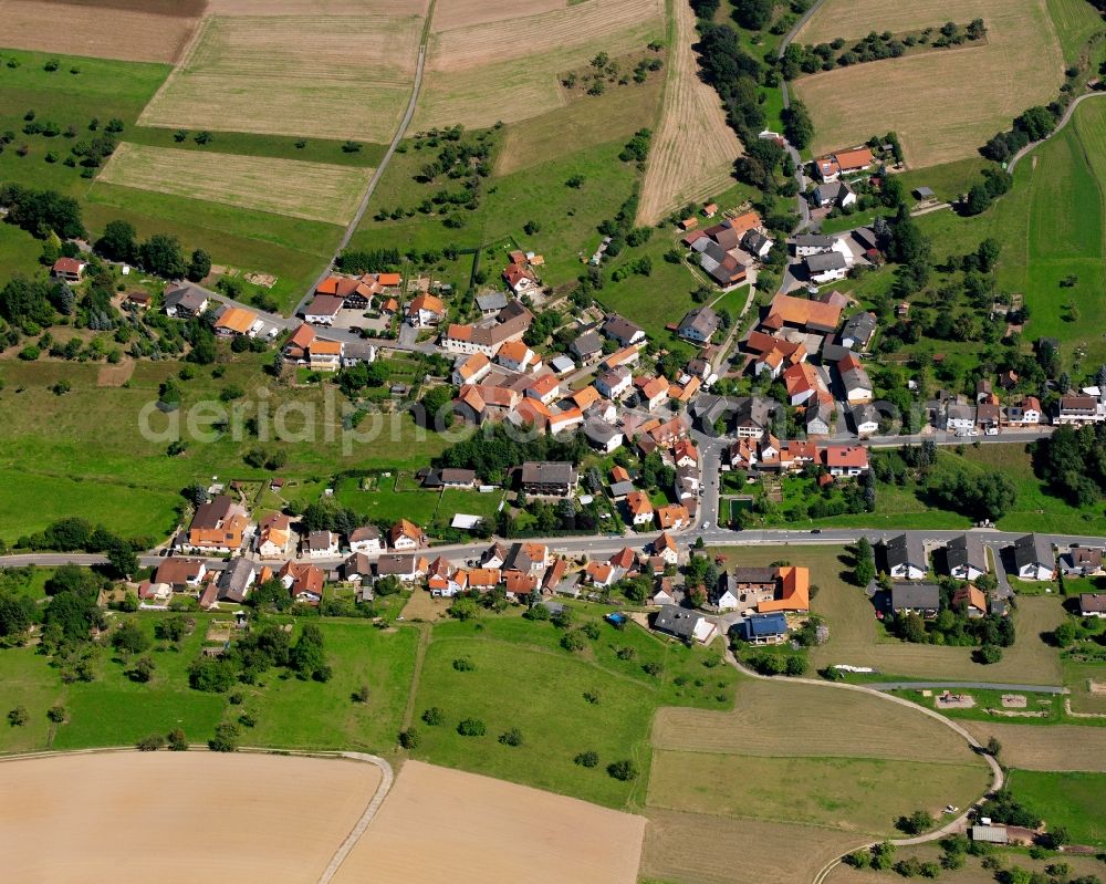 Aerial image Breitenbrunn - Agricultural land and field boundaries surround the settlement area of the village in Breitenbrunn in the state Hesse, Germany