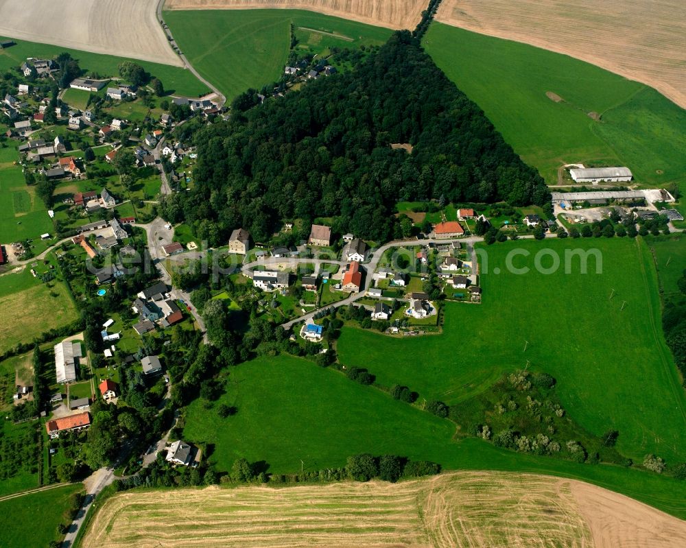 Börnichen from above - Agricultural land and field boundaries surround the settlement area of the village in Börnichen in the state Saxony, Germany