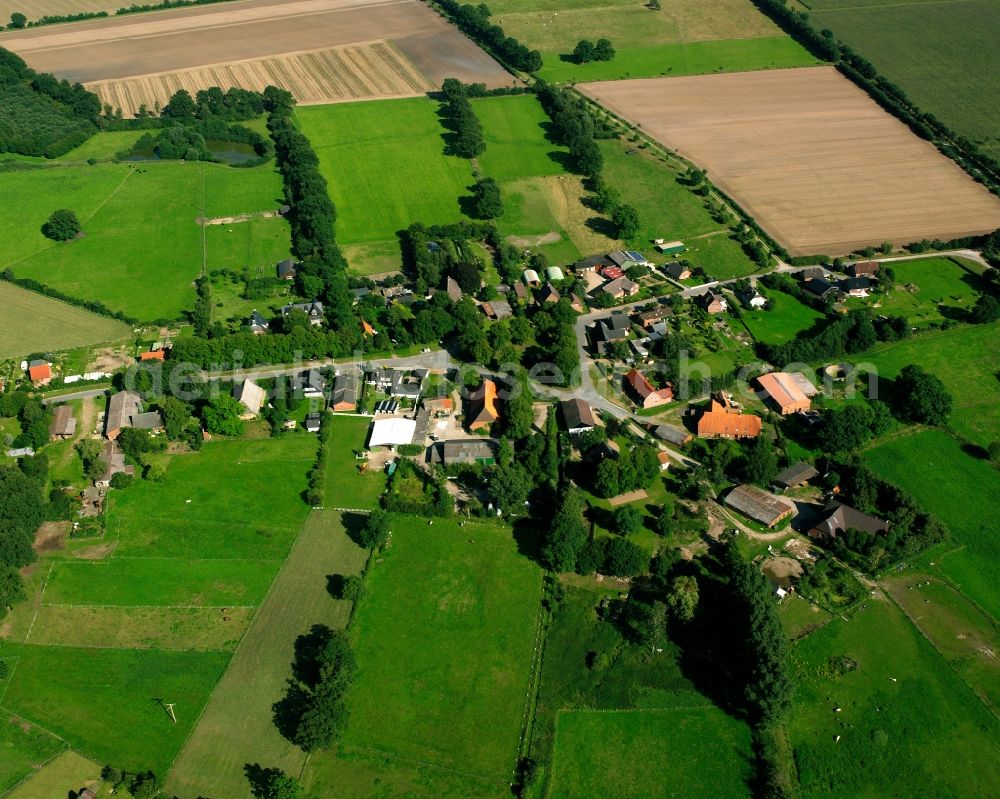 Bröthen from above - Agricultural land and field boundaries surround the settlement area of the village in Bröthen in the state Schleswig-Holstein, Germany