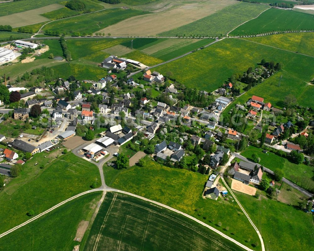 Burkersdorf from above - Agricultural land and field boundaries surround the settlement area of the village in Burkersdorf in the state Saxony, Germany