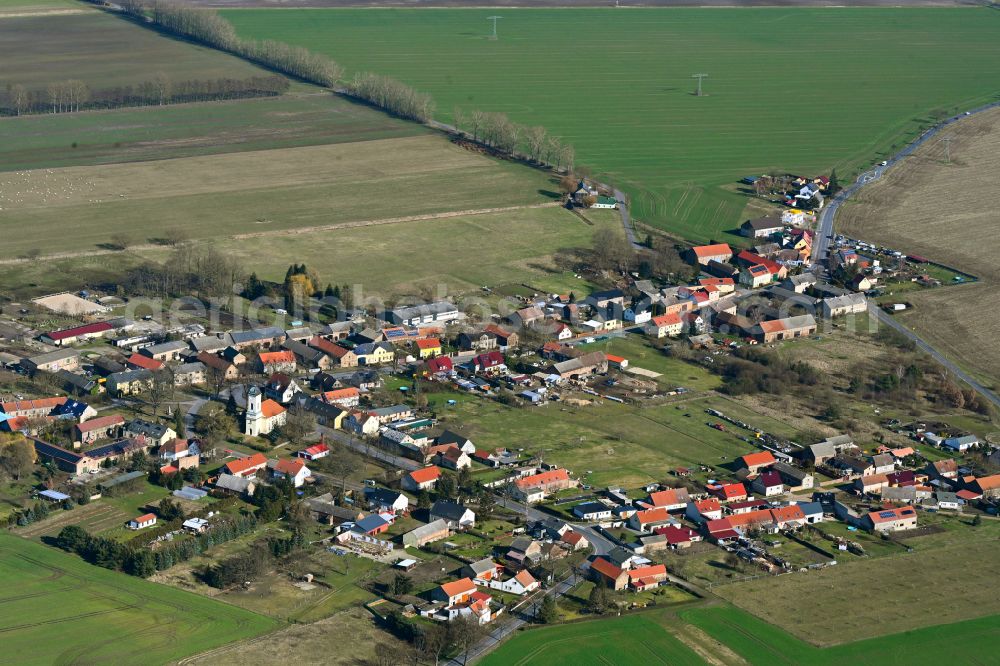 Christinendorf from above - Agricultural land and field boundaries surround the settlement area of the village in Christinendorf in the state Brandenburg, Germany