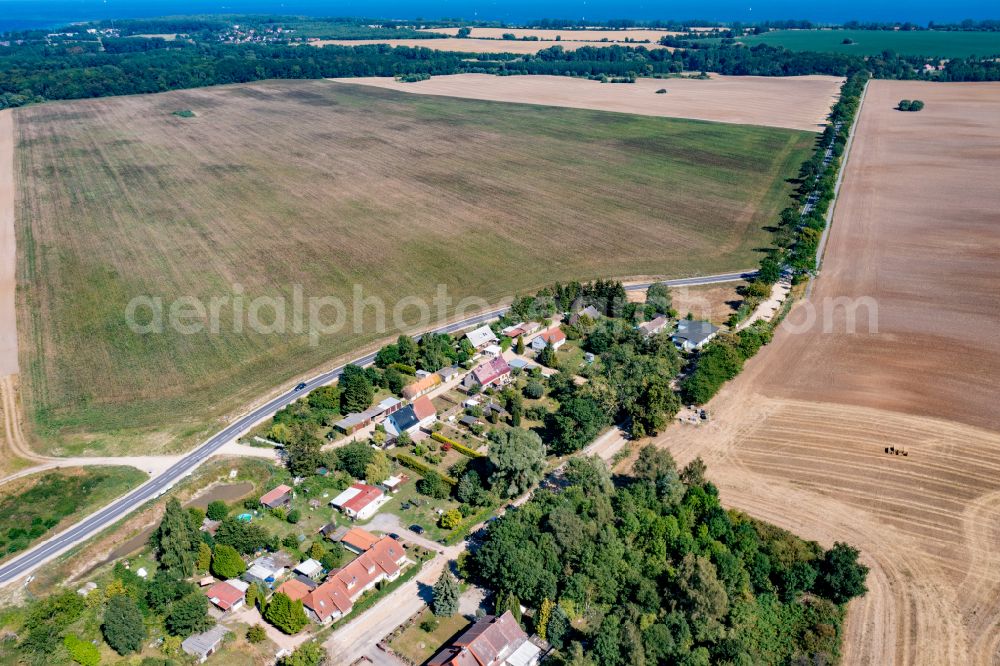 Christinenfeld from the bird's eye view: Agricultural land and field boundaries surround the settlement area of the village in Christinenfeld in the state Mecklenburg - Western Pomerania, Germany
