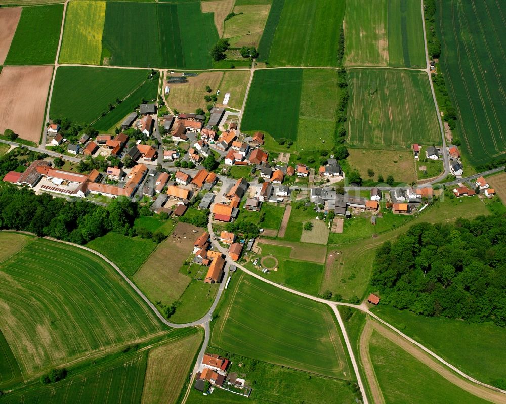 Aerial photograph Dankerode - Agricultural land and field boundaries surround the settlement area of the village in Dankerode in the state Hesse, Germany