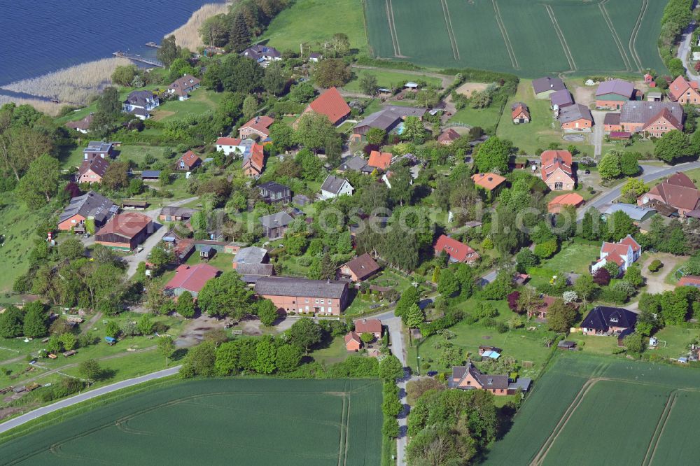 Aerial image Dargow - Agricultural land and field boundaries surround the settlement area of the village in Dargow in the state Schleswig-Holstein, Germany