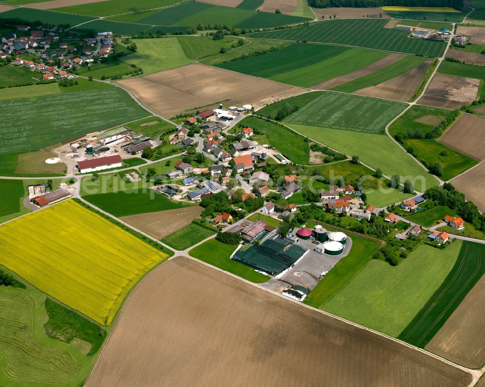 Aerial image Dentingen - Agricultural land and field boundaries surround the settlement area of the village in Dentingen in the state Baden-Wuerttemberg, Germany