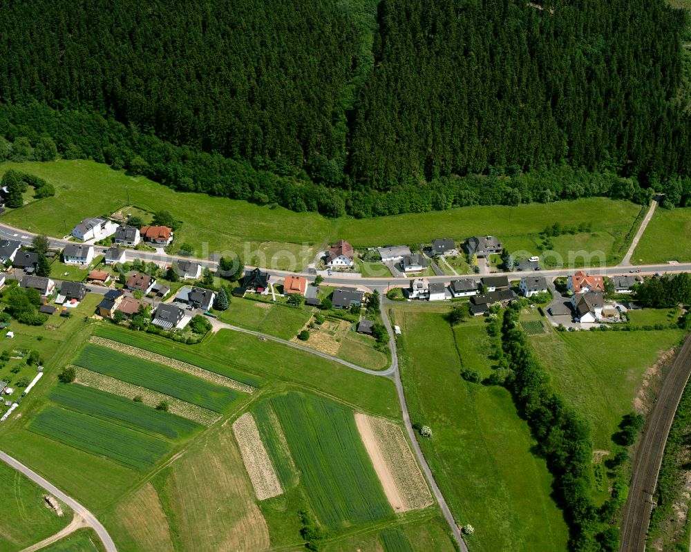 Aerial photograph Dillbrecht - Agricultural land and field boundaries surround the settlement area of the village in Dillbrecht in the state Hesse, Germany