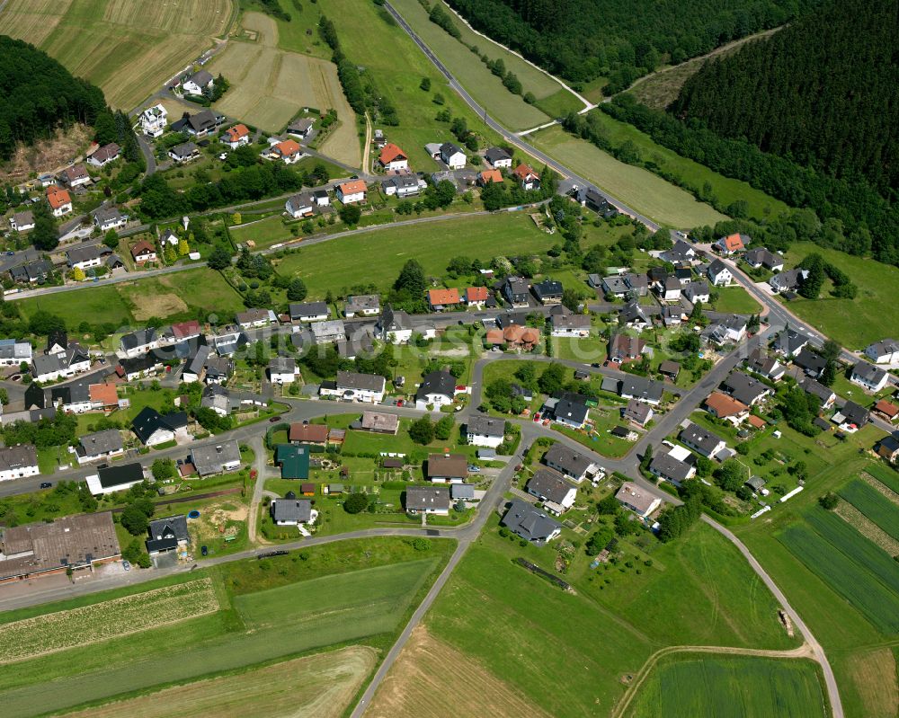 Dillbrecht from above - Agricultural land and field boundaries surround the settlement area of the village in Dillbrecht in the state Hesse, Germany