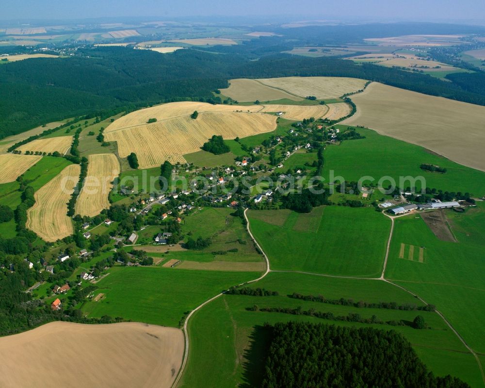 Dittersbach from the bird's eye view: Agricultural land and field boundaries surround the settlement area of the village in Dittersbach in the state Saxony, Germany
