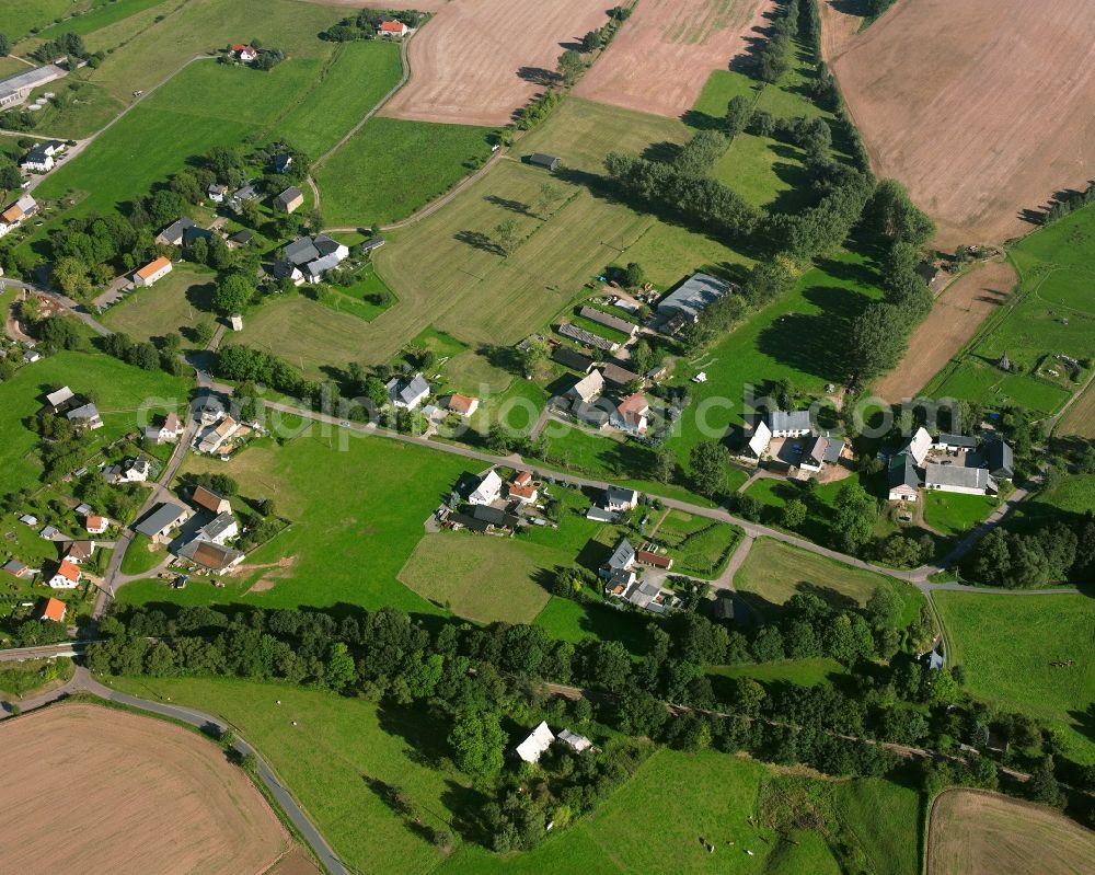 Aerial photograph Dittersbach - Agricultural land and field boundaries surround the settlement area of the village in Dittersbach in the state Saxony, Germany