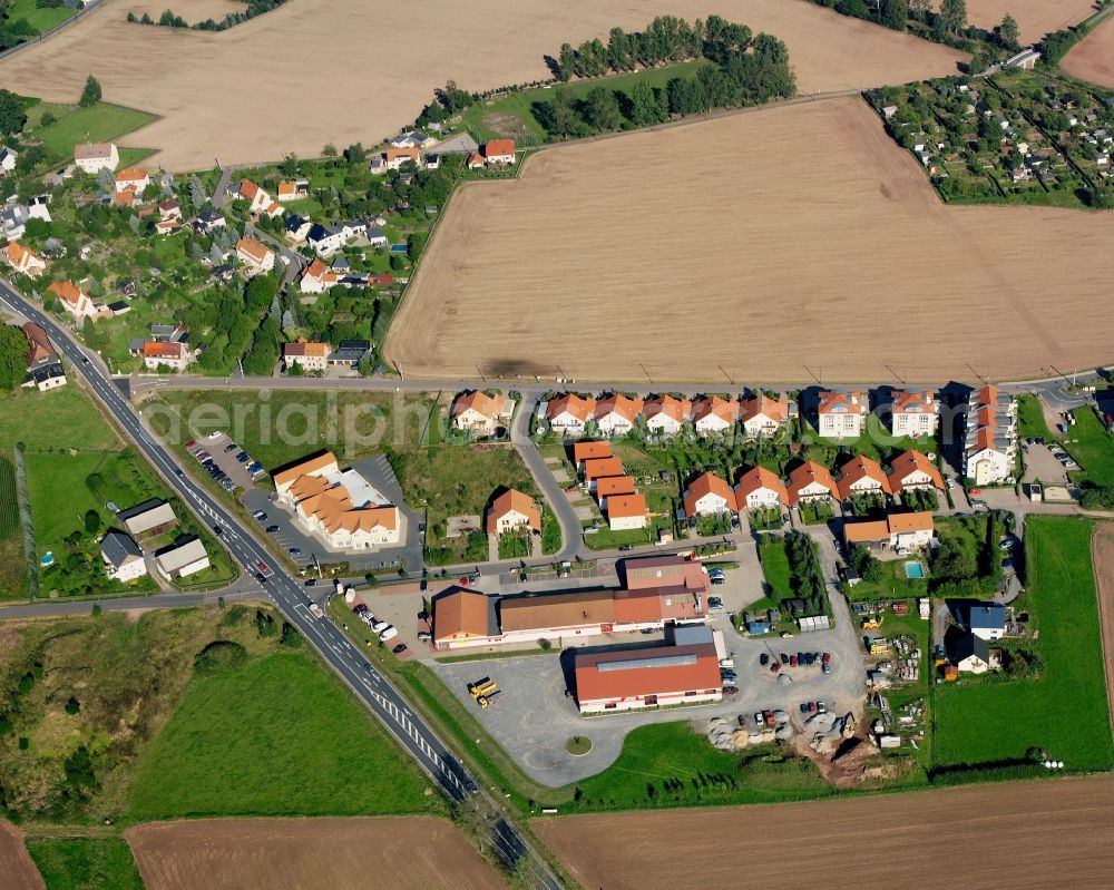 Aerial photograph Dittersbach - Agricultural land and field boundaries surround the settlement area of the village in Dittersbach in the state Saxony, Germany