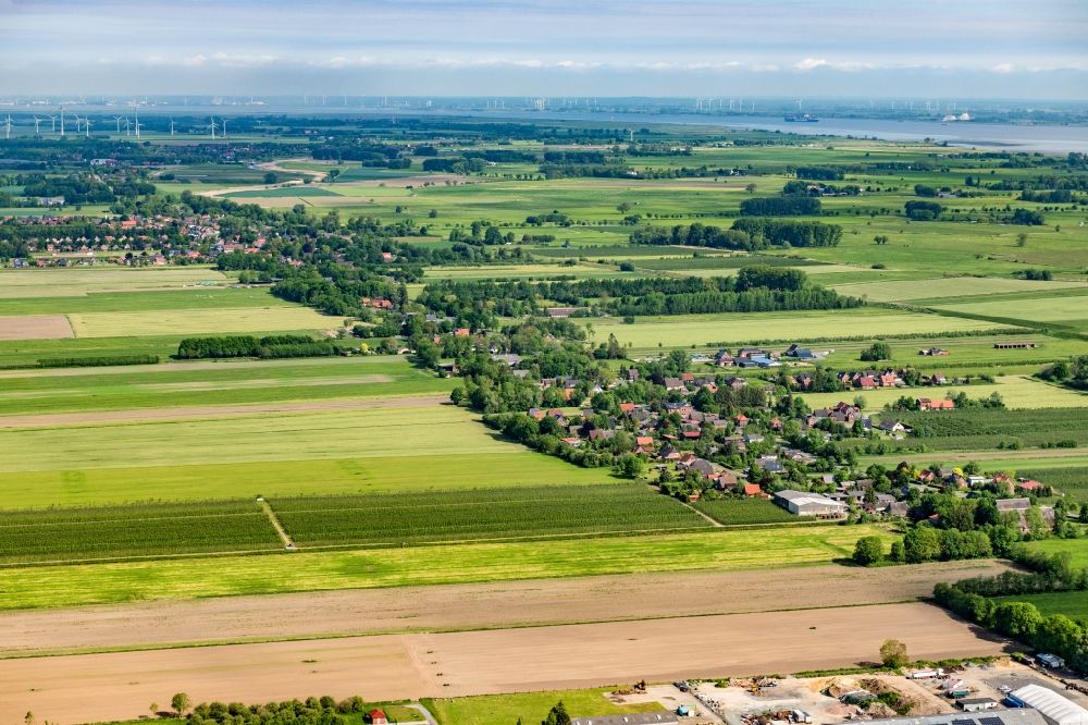 Dornbusch from the bird's eye view: Agricultural land and field boundaries surround the settlement area of the village in Dornbusch in the state Lower Saxony, Germany