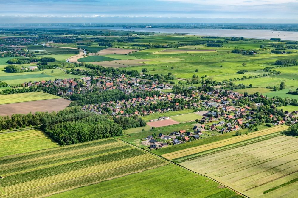 Dornbusch from above - Agricultural land and field boundaries surround the settlement area of the village in Dornbusch in the state Lower Saxony, Germany