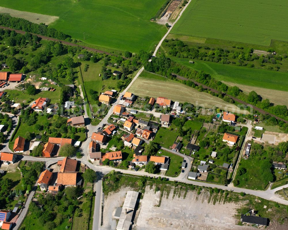 Aerial photograph Drübeck - Agricultural land and field boundaries surround the settlement area of the village in Drübeck in the state Saxony-Anhalt, Germany