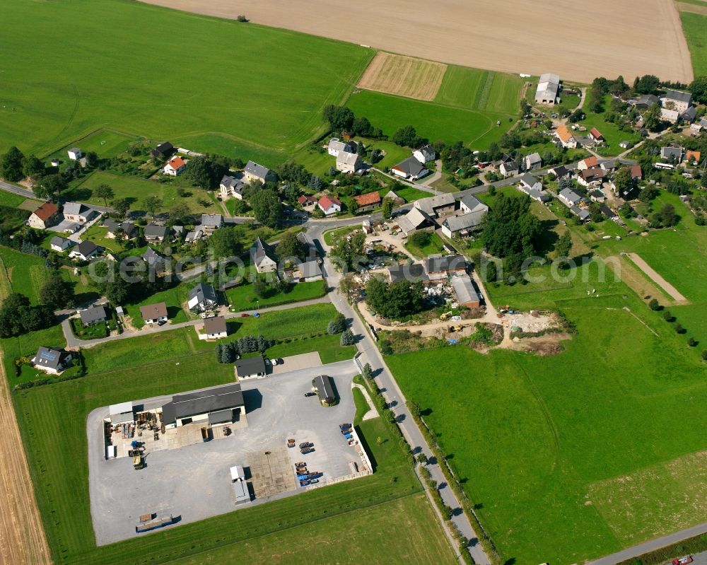 Ebersbach from above - Agricultural land and field boundaries surround the settlement area of the village in Ebersbach in the state Saxony, Germany
