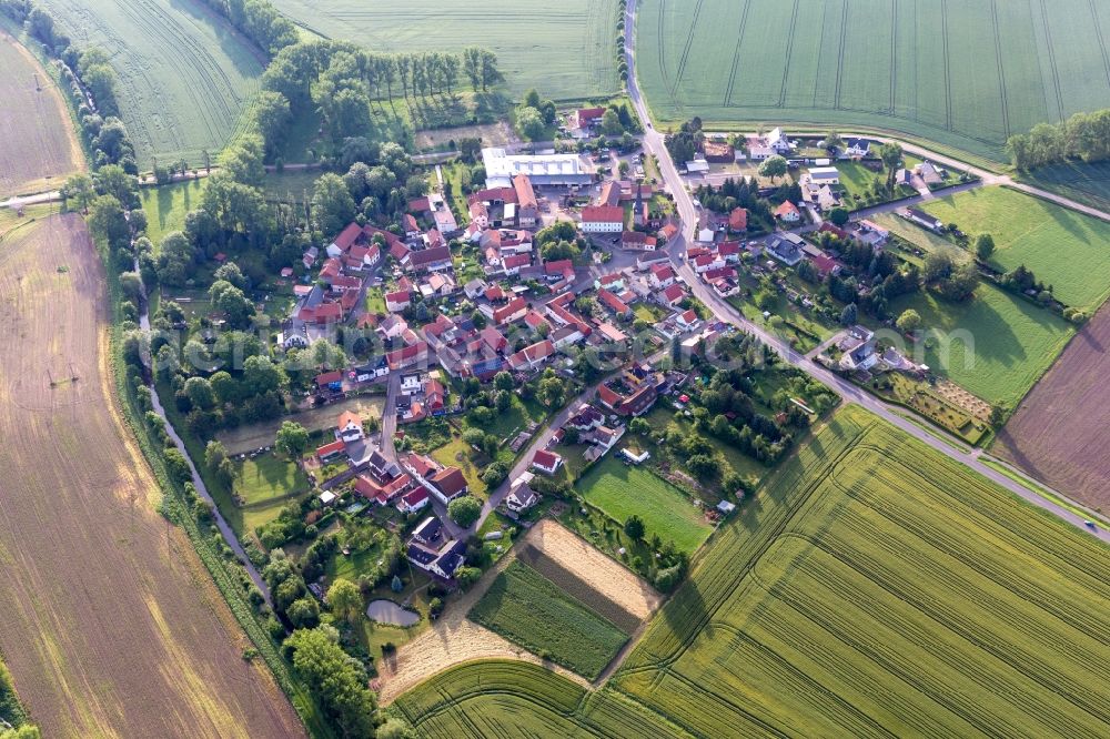 Aerial photograph Eberstädt - Agricultural land and field boundaries surround the settlement area of the village in Eberstaedt in the state Thuringia, Germany