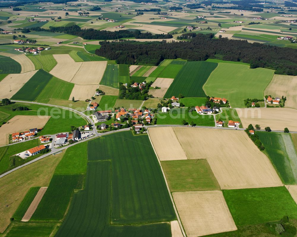 Edelham from the bird's eye view: Agricultural land and field boundaries surround the settlement area of the village in Edelham in the state Bavaria, Germany