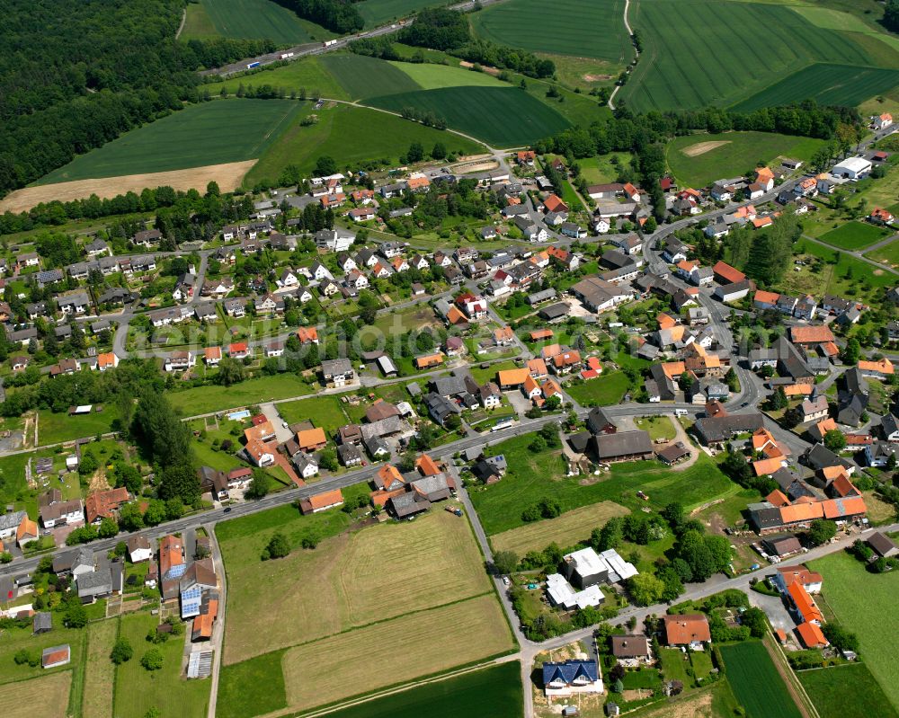 Aerial image Eifa - Agricultural land and field boundaries surround the settlement area of the village in Eifa in the state Hesse, Germany