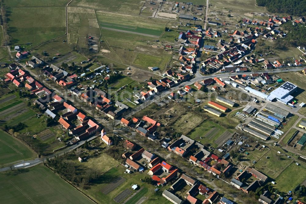 Aerial image Buchholz - Agricultural land and field boundaries surround the settlement area of the village along the Dorfstrasse in Buchholz in the state Brandenburg, Germany