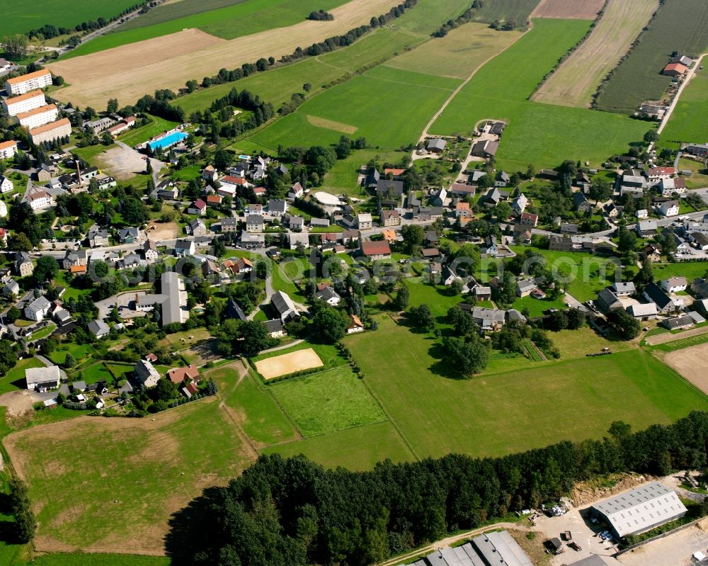 Eppendorf from the bird's eye view: Agricultural land and field boundaries surround the settlement area of the village in Eppendorf in the state Saxony, Germany