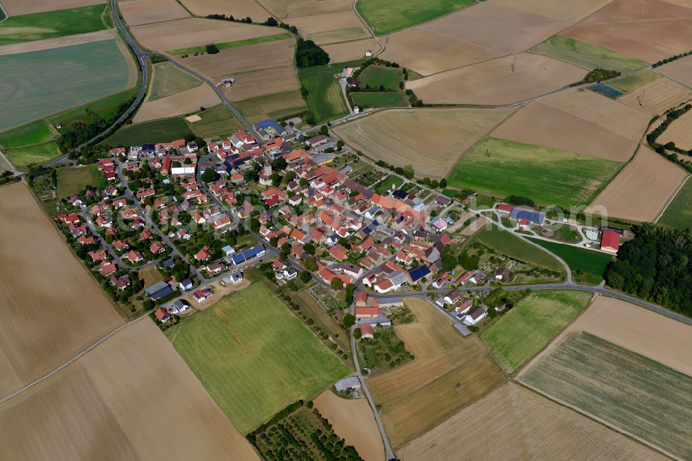 Erlach from the bird's eye view: Agricultural land and field boundaries surround the settlement area of the village in Erlach in the state Bavaria, Germany