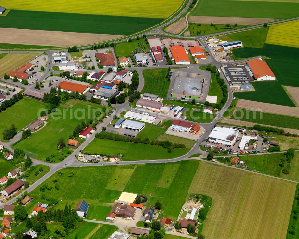 Aerial photograph Erolzheim - Agricultural land and field boundaries surround the settlement area of the village in Erolzheim in the state Baden-Wuerttemberg, Germany