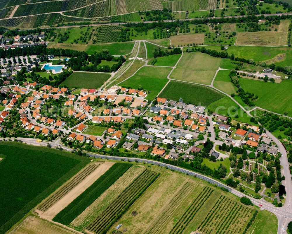 Eschenau from the bird's eye view: Agricultural land and field boundaries surround the settlement area of the village in Eschenau in the state Baden-Wuerttemberg, Germany