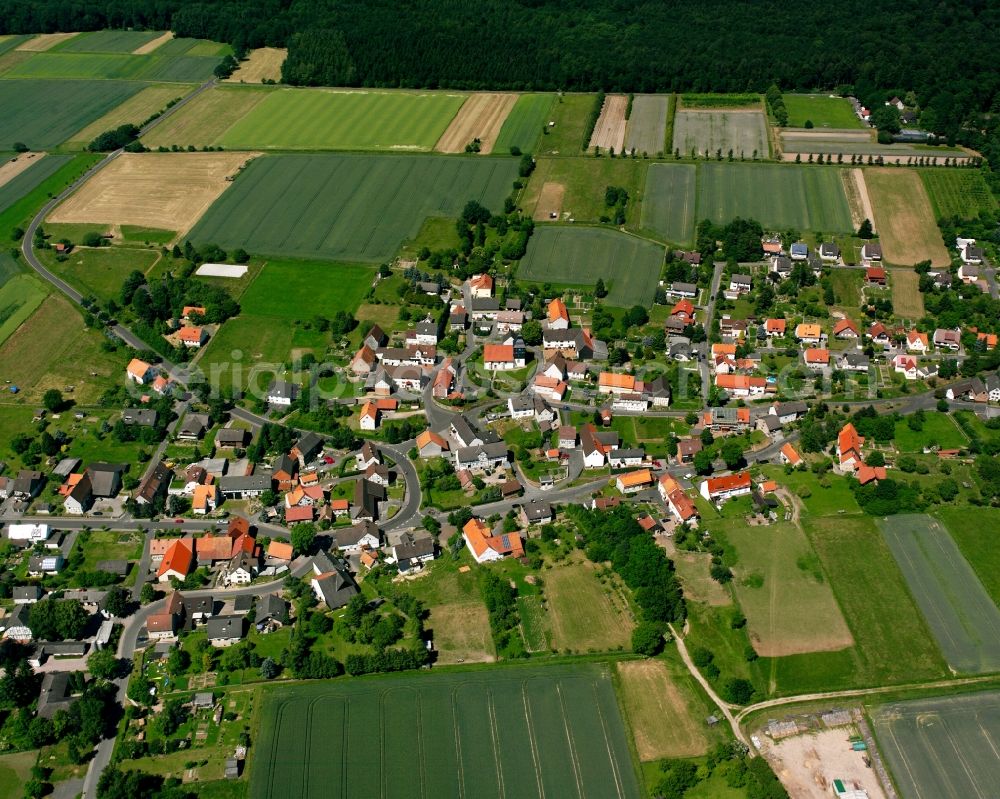 Escherode from the bird's eye view: Agricultural land and field boundaries surround the settlement area of the village in Escherode in the state Lower Saxony, Germany
