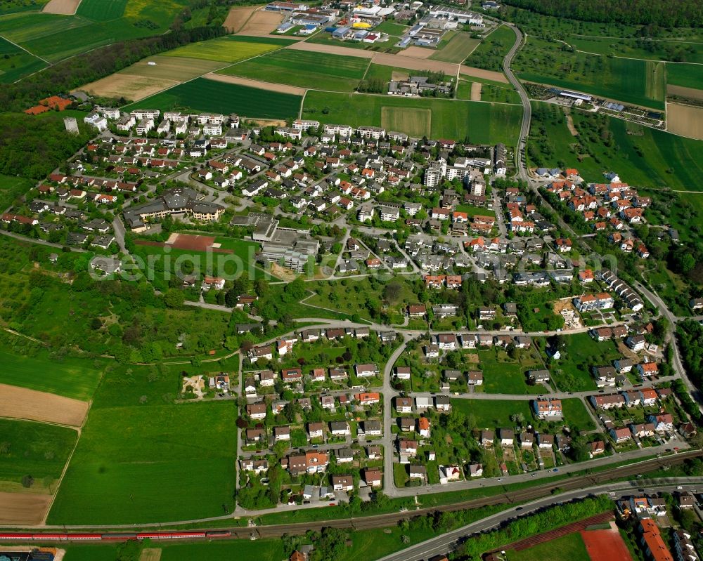 Faurndau from above - Agricultural land and field boundaries surround the settlement area of the village in Faurndau in the state Baden-Wuerttemberg, Germany
