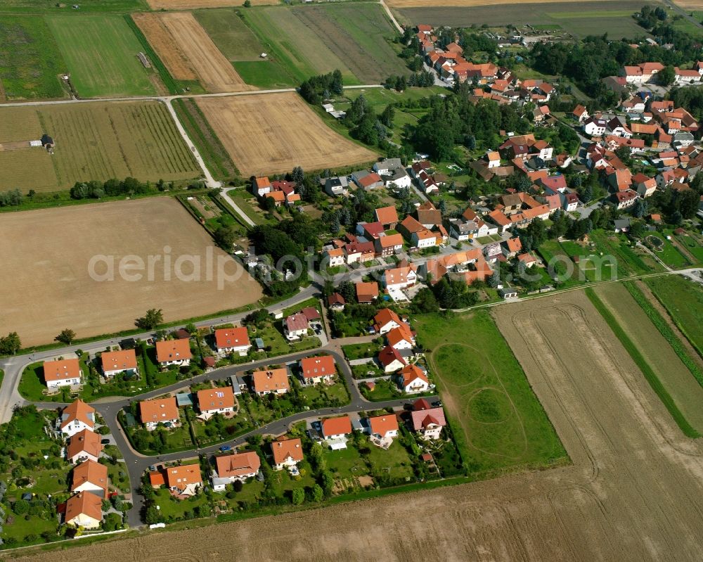 Felchta from above - Agricultural land and field boundaries surround the settlement area of the village in Felchta in the state Thuringia, Germany
