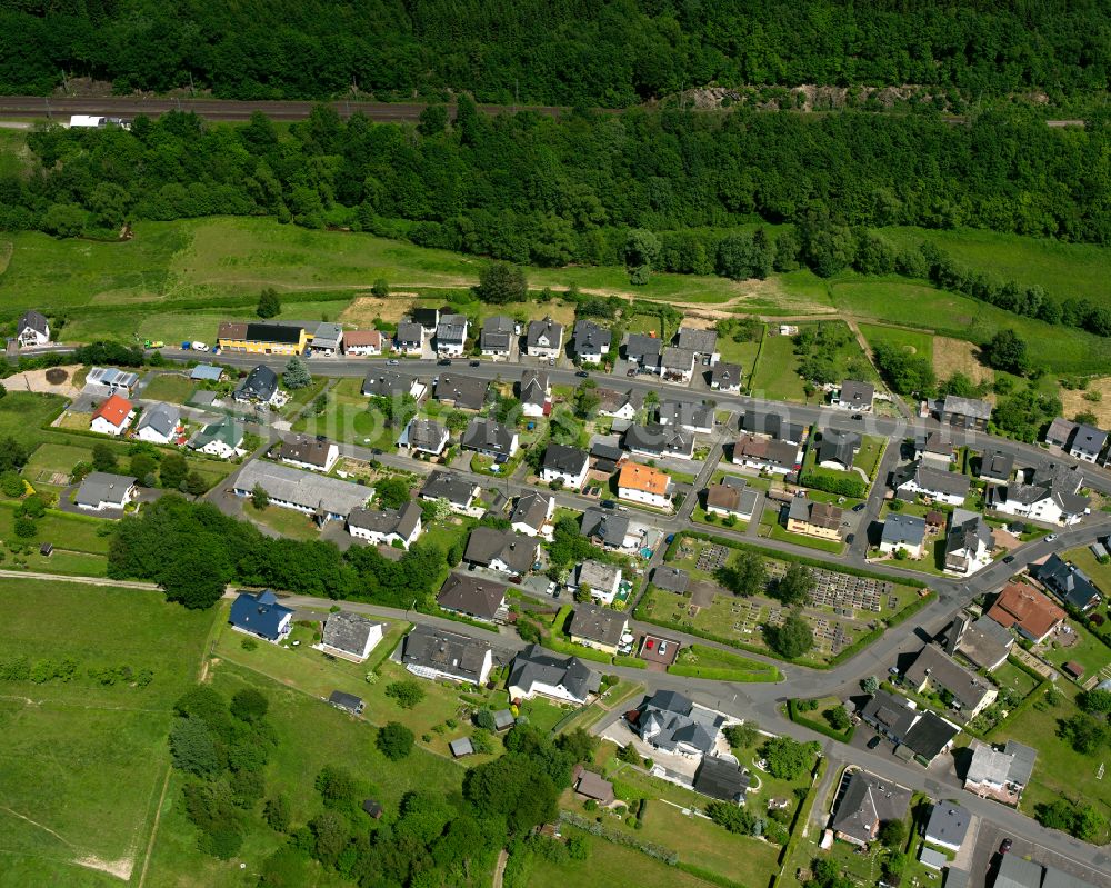 Fellerdilln from above - Agricultural land and field boundaries surround the settlement area of the village in Fellerdilln in the state Hesse, Germany